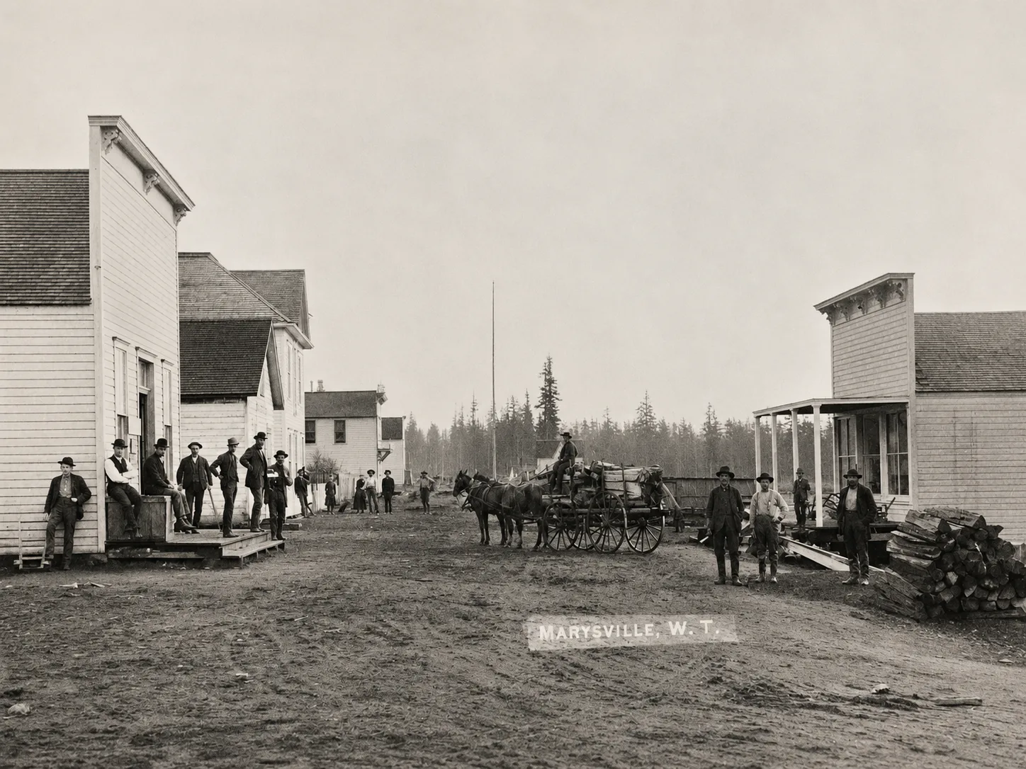 Historic Front Street view at First and Ash in Marysville, Washington Territory, with storefronts, people, and a horse-drawn wagon.